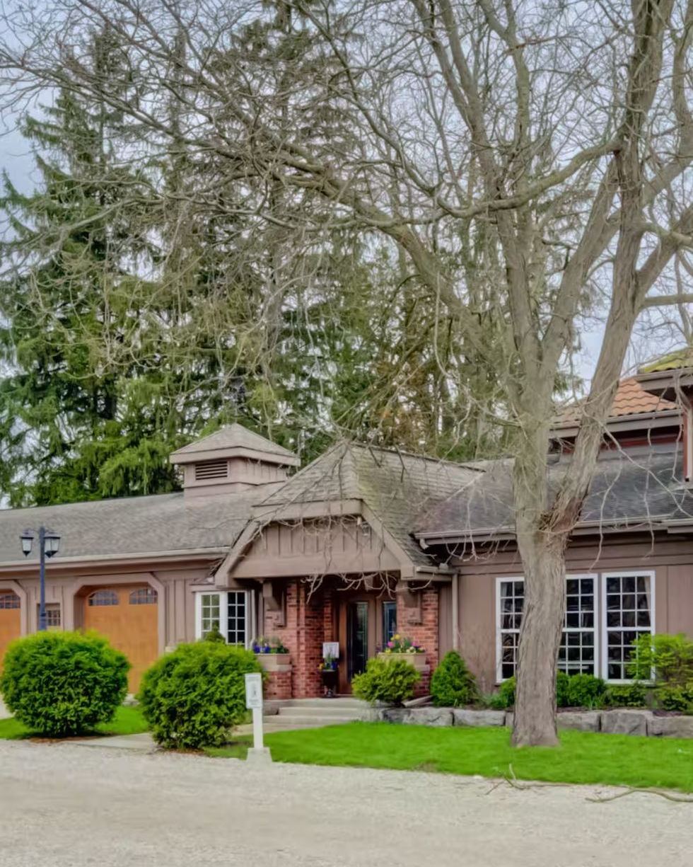 The Windmill Studio exterior under tall pines